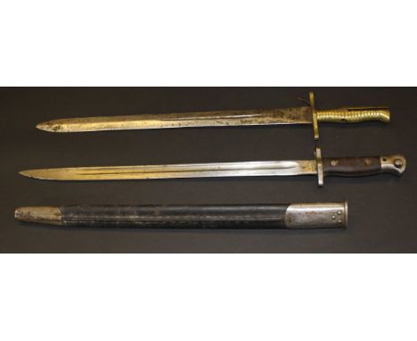 A George V Wilkinson 1907 pattern bayonet with fullered blade and wooden grip, housed in a steel mounted leather scabbard, to