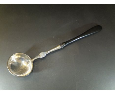 A 19th Century white metal and ebony handled soup ladle, initialled "FB" to front and stamped "Hartman" to back
