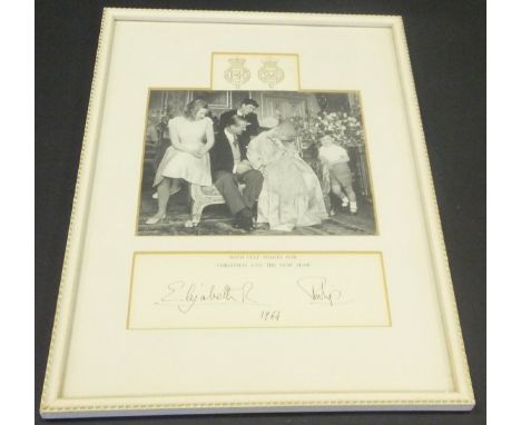 A framed and glazed image of the Royal Family and the infant Prince Edward adapted from the 1964 Christmas card signed (proba