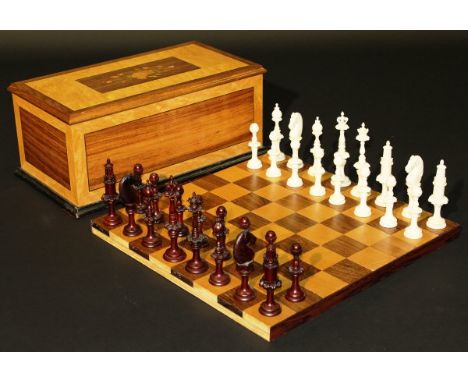 A turned ivory and stained ivory chess set, the pieces turned by A. W. Jones in the early 80's from the buttons rescued from 