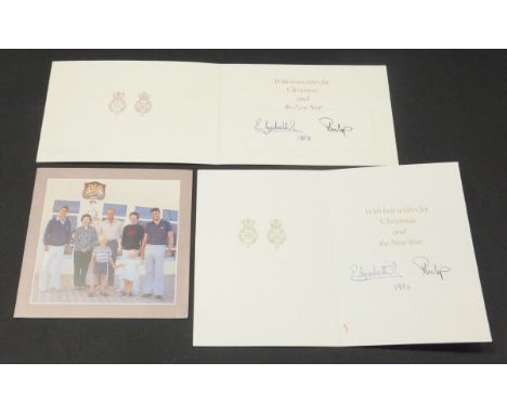 A Christmas card from Her Majesty The Queen and Prince Philip depicting The Queen and Prince Philip with Prince Andrew 1982 s