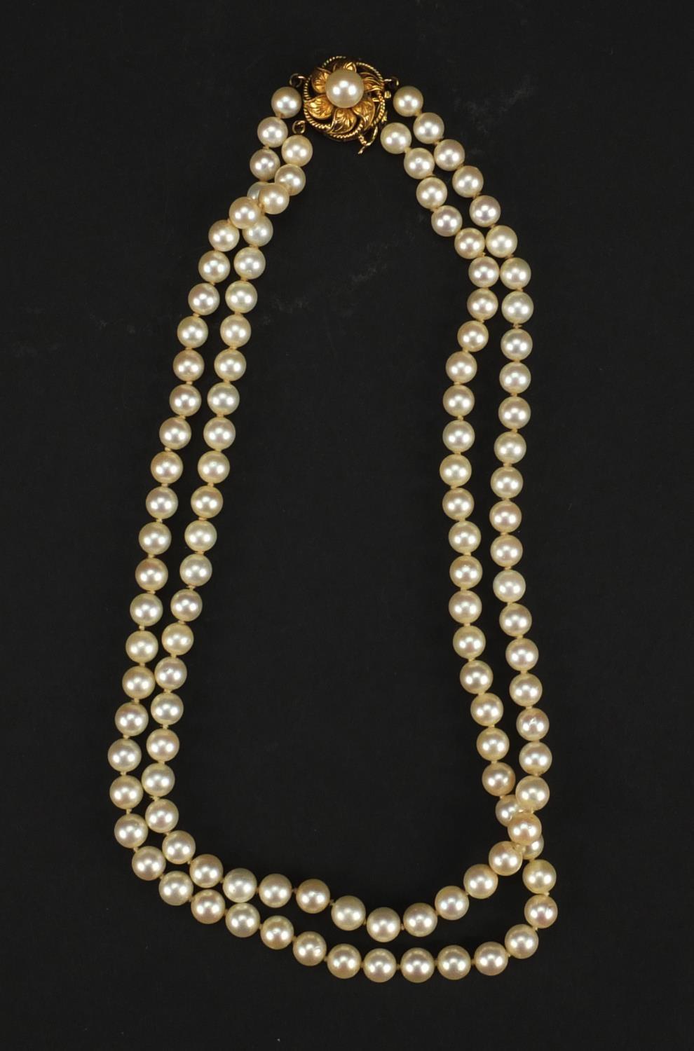 Two string cultured pearl necklace with 14ct gold clasp, 38cm long