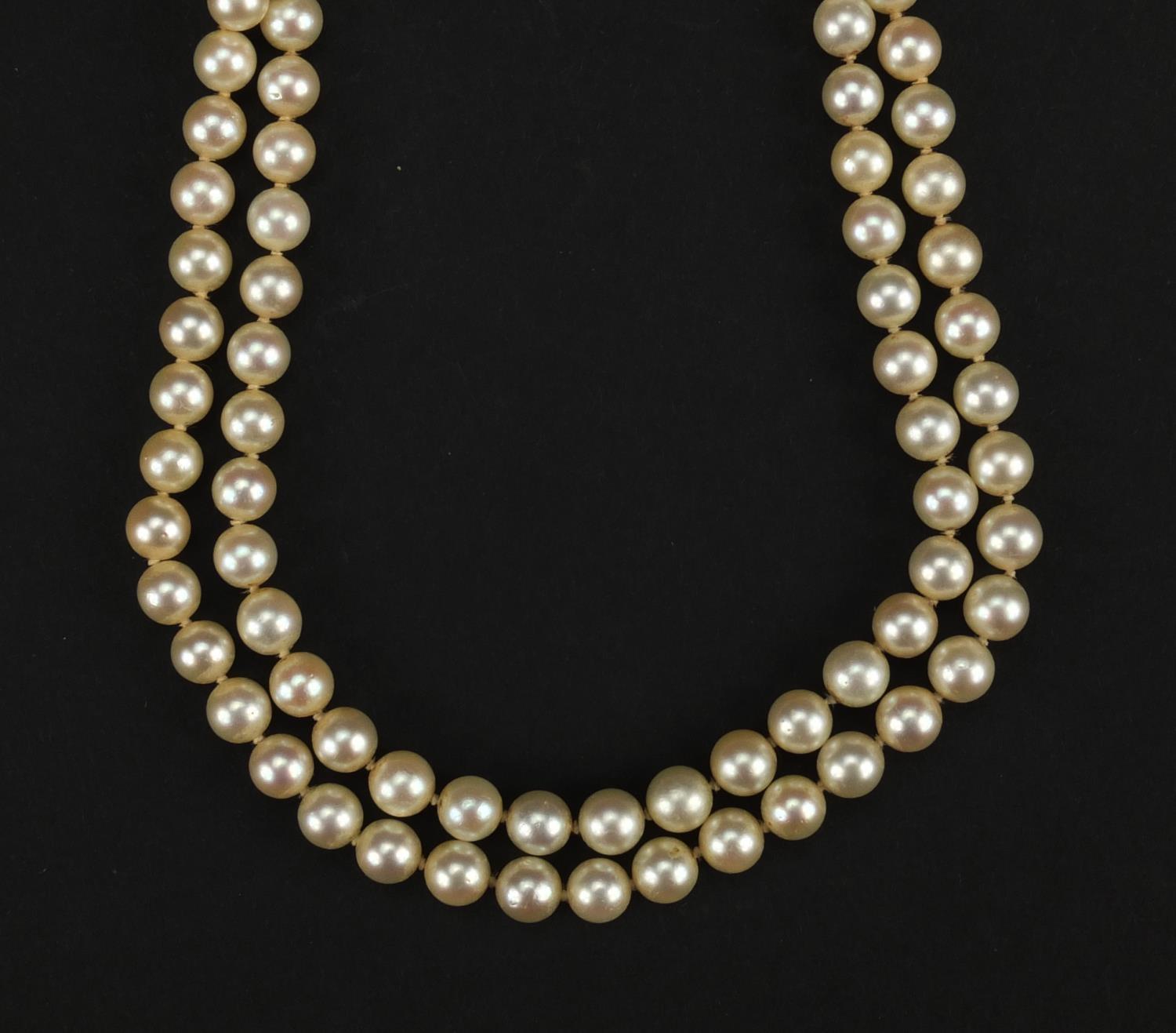 Two string cultured pearl necklace with 14ct gold clasp, 38cm long