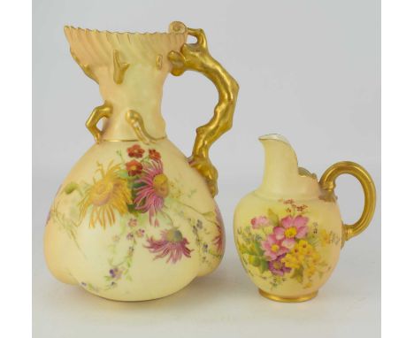 WORCESTER; two blush ivory floral decorated porcelain ewer jugs, the tallest with branch handles, height 18.5cm, height of th