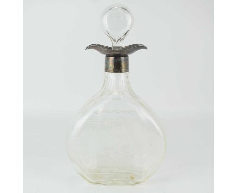 A George V wheel cut blown glass decanter of flask form, with stopper and hallmarked silver top, decorated in a wheel cut Cel