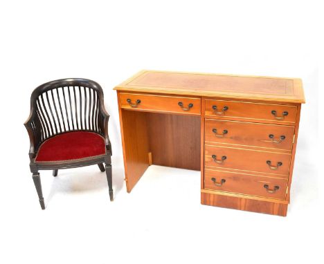 A modern light wood desk with two drawers over a cabinet, with three-drawer faux front, tooled brown leather inset top, 78 x 