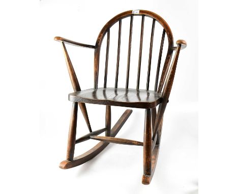 A children’s wooden stick back rocking chair, height 74cm.