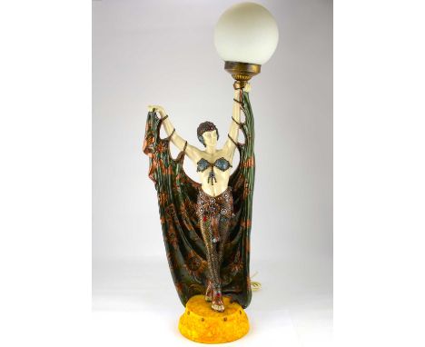 A modern resin Art Deco stylised dancer table lamp with globe shade, height 80cm.