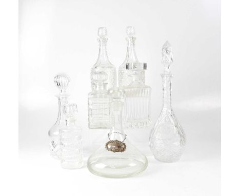 A small group of decanters, including a contemporary ship's decanter with blank hallmarked silver label, WI Broadway &amp; Co