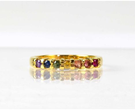 An 18ct yellow gold ring set with seven different coloured stones, size P, approx. 3.8g.Condition Report: Overall good but us