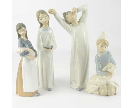 LLADRÓ; four porcelain figures of children, comprising a girl with lamb, a girl with a chamber stick, a girl with piglet and 