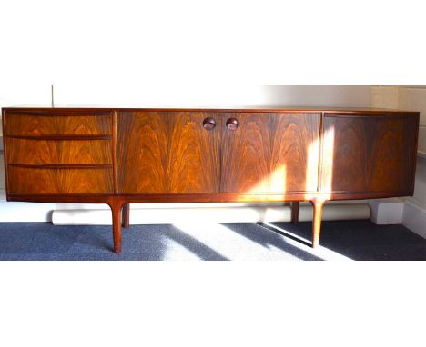 X A late 1960s rosewood sideboard by Tom Robertson for A.H MacIntosh Ltd, Kirkcaldy, comprising a central double cupboard fla