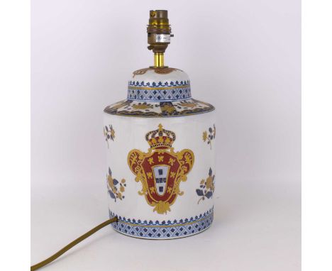 A modern porcelain table lamp in the form of a 19th century French jar and cover, with enamelled decoration and gilt-heighten