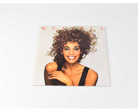 WHITNEY HOUSTON; a 'Moment of Truth Tour 1988' programme signed to inner page 'Whitney'.Condition Report: - We have not authe