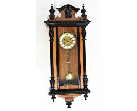 A Vienna wall clock with mahogany ebonised case, the ivorine chapter ring set with Roman numerals, height 89cm.Condition Repo