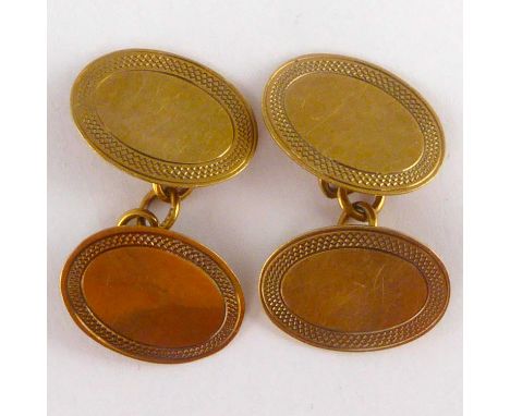 A pair of 9ct gold oval cufflinks united with chain, combined approx. 3.8g.