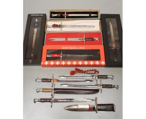 ELEVEN JAPANESE MADE MINIATURE BAYONETS FOR THE US AND SWISS MARKET, comprising four boxed Swiss examples and seven US, two b