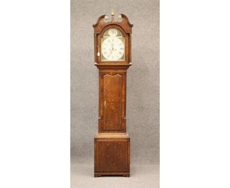 AN OAK LONGCASE CLOCK by Dodson, Holbeck, the eight day movement with anchor escapement striking on a bell, 13" arched dial p