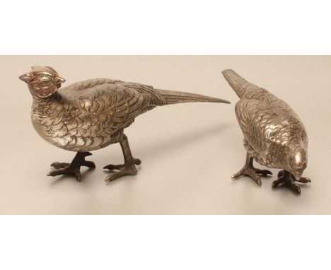 A PAIR OF CHINESE HOLLOW CAST PEWTER PHEASANTS, modelled standing, the cock with remains of red enamel paint to face, seal ma