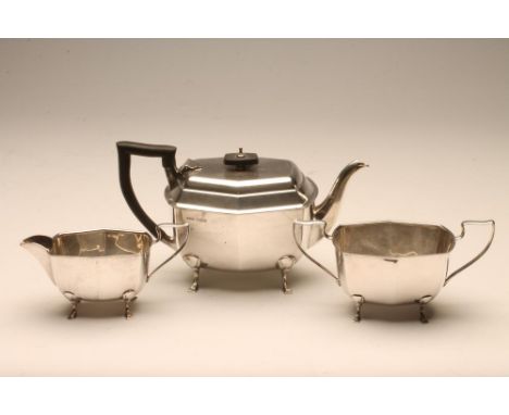 A SILVER THREE PIECE TEA SERVICE, maker Harrison, Fisher &amp; Co., Sheffield 1946, of rounded quatrefoil form raised upon fo