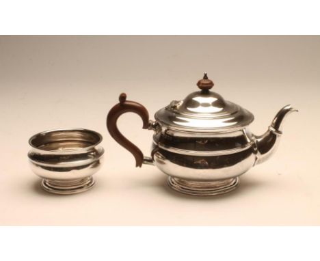 A SILVER TEAPOT AND SUGAR BASIN, maker Robert Stewart, London 1922, of girdled squat globular form, engraved "L", the teapot 