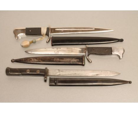 THREE GERMAN MINIATURE SOUVENIR BAYONETS,1918-1933, all with metal scabbards, comprising an m.98 bayonet with officer's knot 