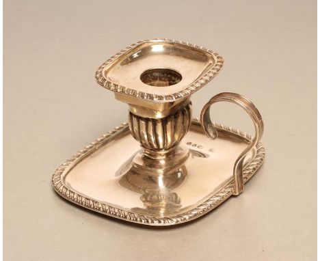 A LATE VICTORIAN SILVER CHAMBER STICK, maker Finley &amp; Taylor, London 1891, of rounded oblong form with cast and applied g