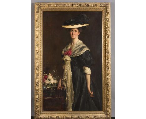 RICHARD JACK (1866-1952), Portrait of a Lady standing and wearing a Plumed Hat, three quarter length, oil on canvas, signed, 