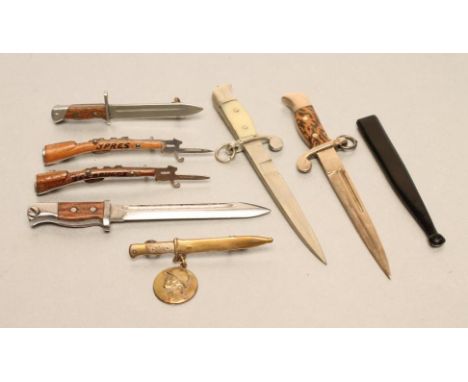 SEVEN SWEETHEART BROOCH BAYONETS, four from the mid-war period, comprising two Belgian brooches in the form of bayoneted rifl