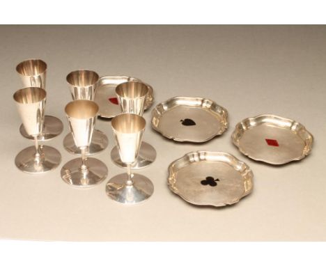 A SET OF FOUR SILVER BRIDGE COASTERS, maker Deakin &amp; Francis, Birmingham 1912, of shaped rounded square form with pie-cru