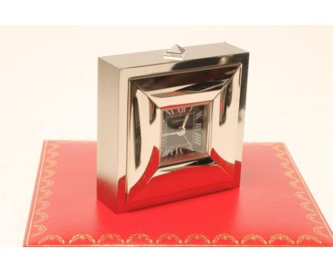 A CARTIER ALARM CLOCK, the square black dial with stylised Roman numerals and luminous hands in a palladium square cushion ca