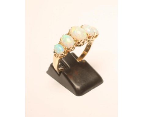 A FIVE STONE OPAL RING, the oval cabochon polished stones claw set to a plain shank, size P 1/2 (Est. plus 21% premium inc. V