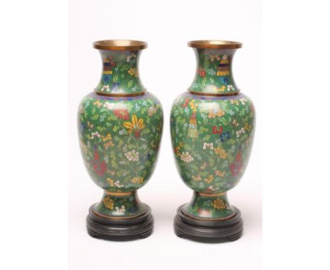 A PAIR OF CHINESE CLOISONNE ENAMEL VASES, of rounded cylindrical form with waisted necks on spreading foot, inlaid in colours