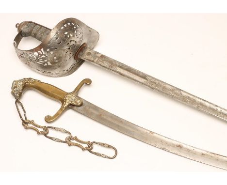 AN 1897 PATTERN OFFICER'S SWORD, the 32 1/4" blade etched with Royal coat of arms and crown over ER VII within foliate scroll