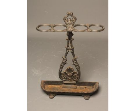 A COALBROOKDALE STYLE CAST IRON STICK STAND, c.1900, the open leaf moulded pear shaped back plate surmounted by a loop handle