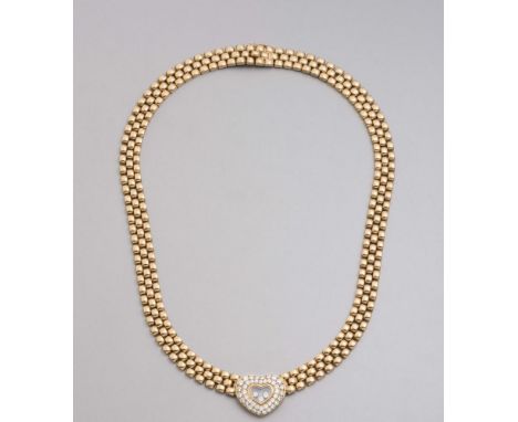 A CHOPARD FLOATING DIAMOND PENDANT AND NECKLACE, the heart shaped glass panel engraved Chopard and enclosing three floating s