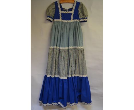 A 1970s cotton 'hand-made by Elizabeth' hotchpotch prairie dress with tiered skirt incorporating Liberty print fabric and emb