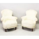 A GOOD PAIR OF TUB ARMCHAIRS on turned legs.