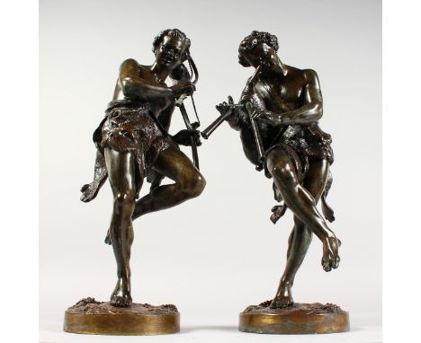 A VERY GOOD PAIR OF 19TH CENTURY FRENCH BRONZE FIGURES, playing musical instruments, standing on circular bases with fruiting