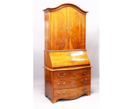A VERY GOOD 18TH CENTURY WALNUT BUREAU BOOKCASE, the top with serpentine moulding, double panel doors over a bureau base with
