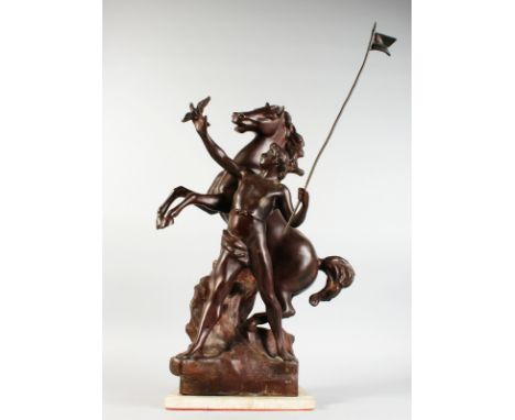 A LARGE BRONZE GROUP, YOUNG MAN WITH MARLEY REARING HORSE, standing on a square base. 25ins high.