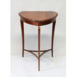 AN EDWARDIAN MAHOGANY KIDNEY SHAPED OCCASIONAL TABLE with slender curving legs and under tier. 1ft