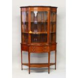 A GOOD EDWARDIAN MAHOGANY SERPENTINE FRONTED CHINA CABINET
