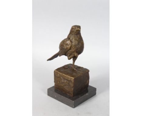 AFTER MILO, A STUDY OF A BIRD. Patinated bronze on an integral base. 8ins high on a marble base.