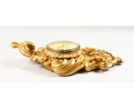 A FRENCH GILTWOOD CARTEL CLOCK. 23ins long.