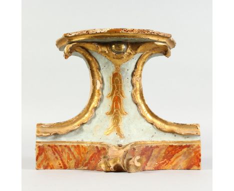 AN ITALIAN CARVED WOOD AND PAINTED BRACKET. 9ins high.