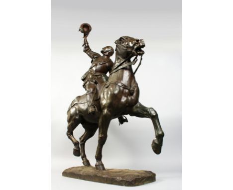A GOOD LARGE BRONZE OF A NOBLEMAN, wearing armour and saluting with his hat, sitting on his horse. 44ins high x 33ins long.