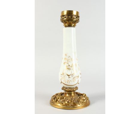 A VICTORIAN MILK GLASS AND BRASS OIL LAMP BASE. 13.5ins high.