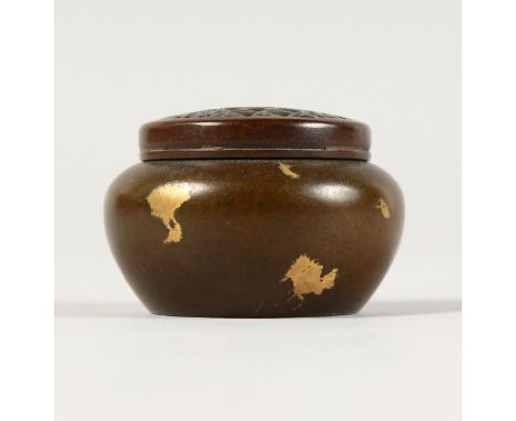 A SMALL CHINESE GOLD SPLASH BRONZE CENSER AND COVER. 2ins diameter.