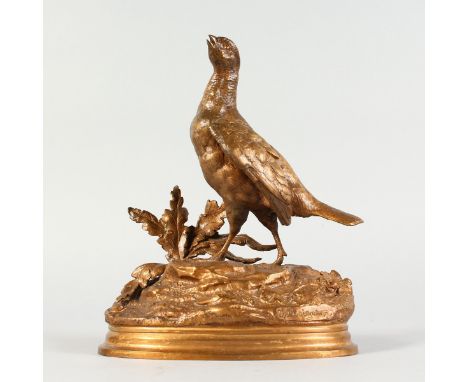 JULES MOIGNIEZ (1835-1894) FRENCH A GOOD GILDED BRONZE HEN PHEASANT, on a naturalistic oval base. Signed.  9.5ins high.